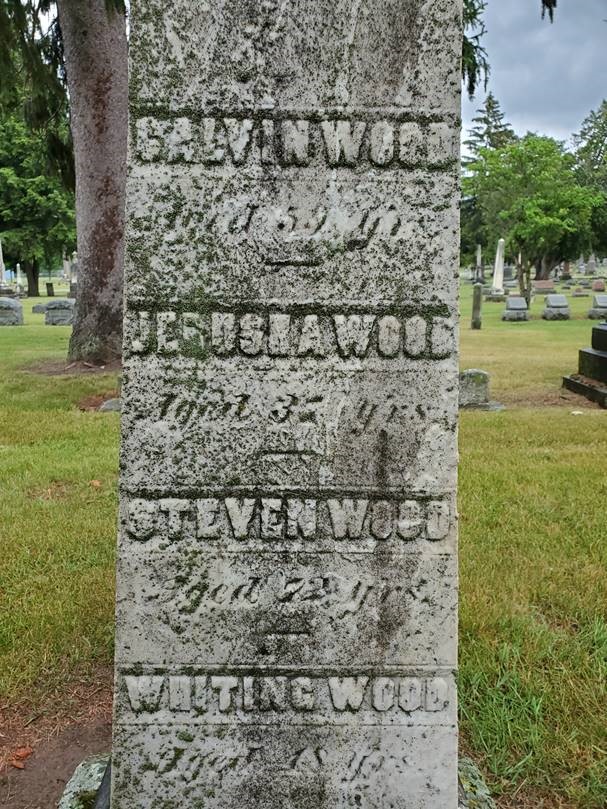 Gray tombstone containing text