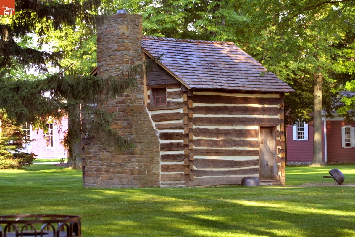 Small log cabin with stone fireplace