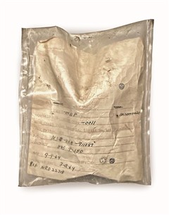Bag with printed label filled in with handwritten text