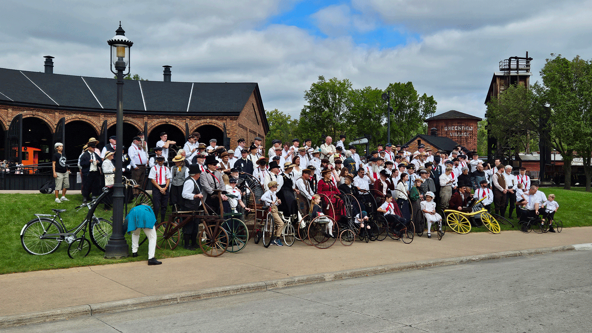 The Wheelmen posed for a group photo in front of the Detroit, Toledo & Milwaukee Roundhouse.