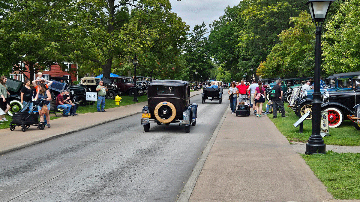 One of Old Car Festival’s simple pleasures is strolling down Maple Lane to watch the Fords go by.