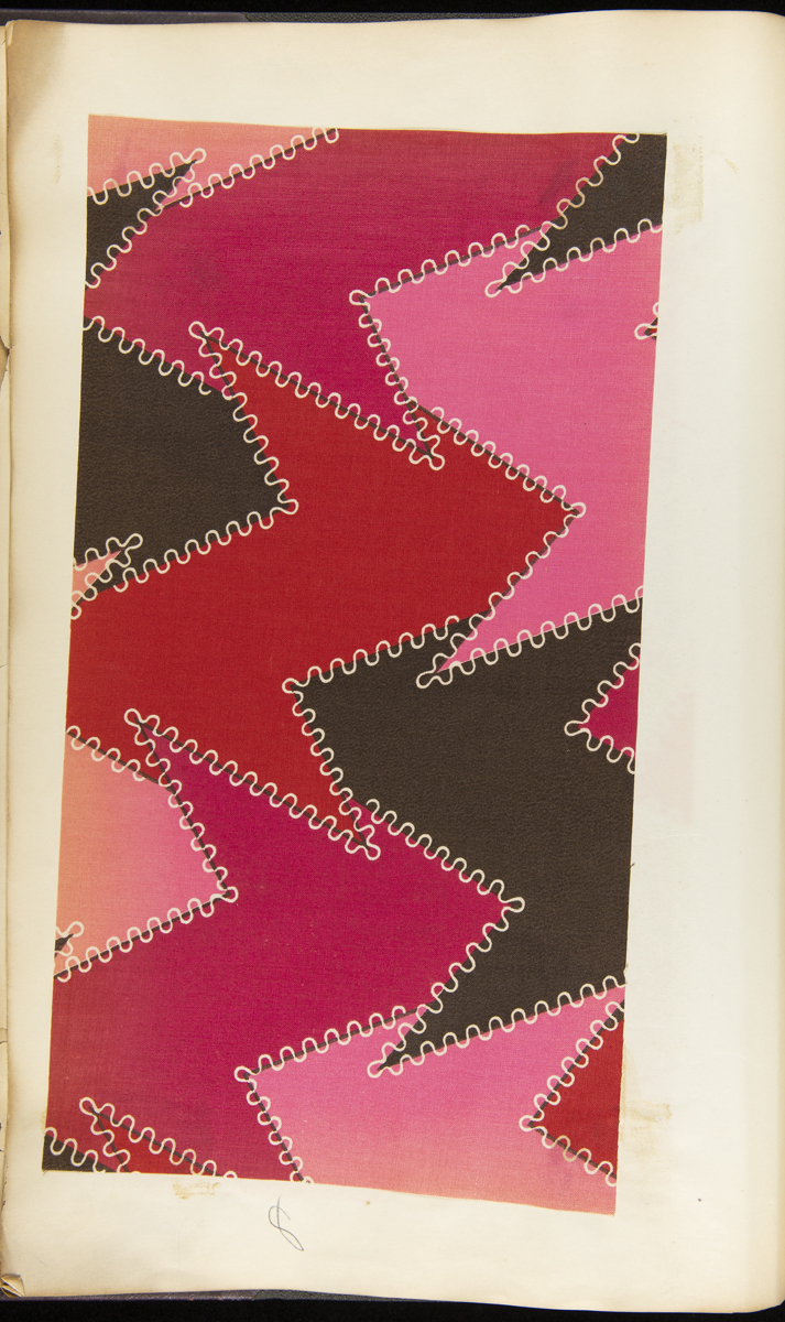 Page containing vivid red, pink, and black fabric swatch in a zigzag pattern