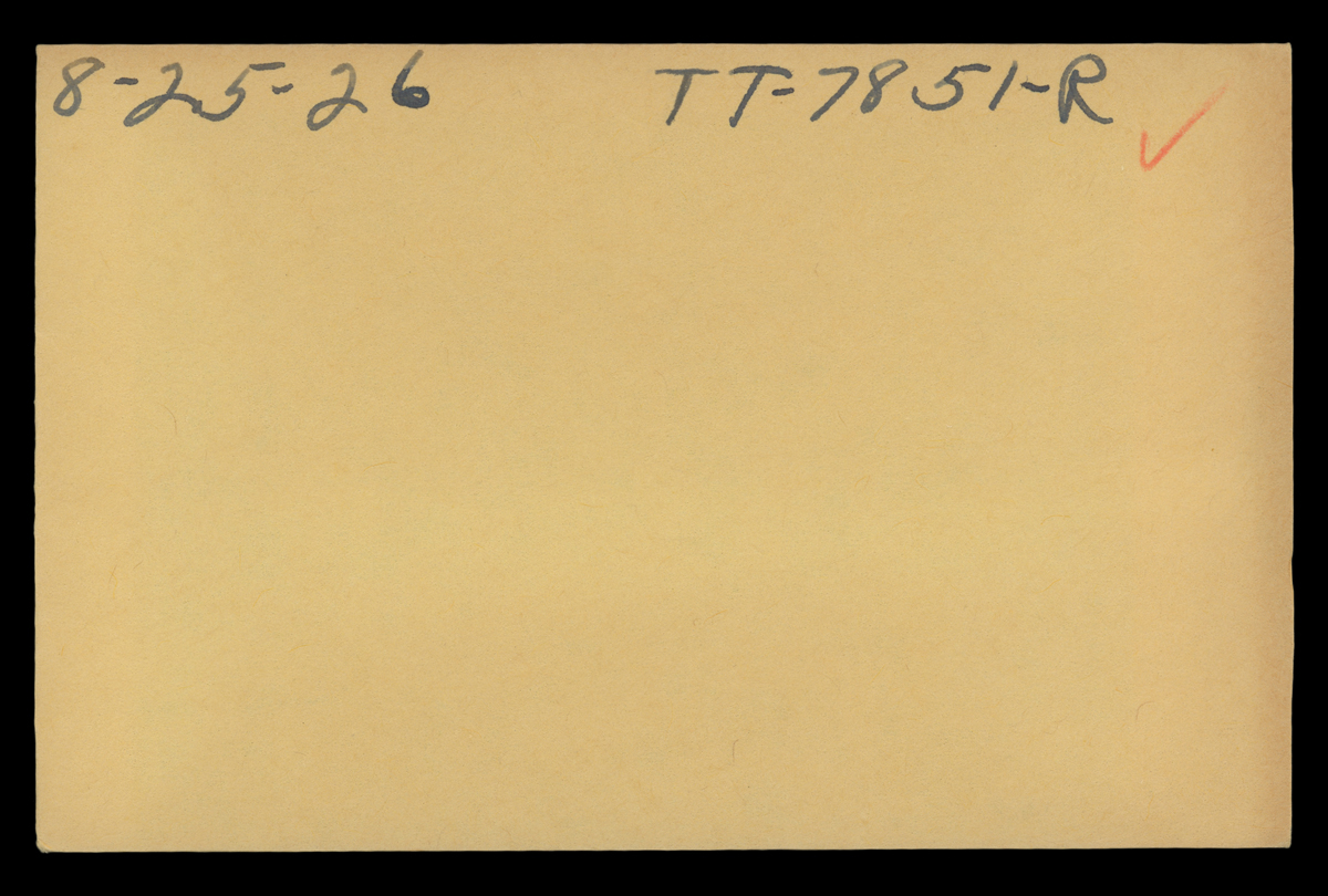 Manila envelope with handwritten numbers and red check mark