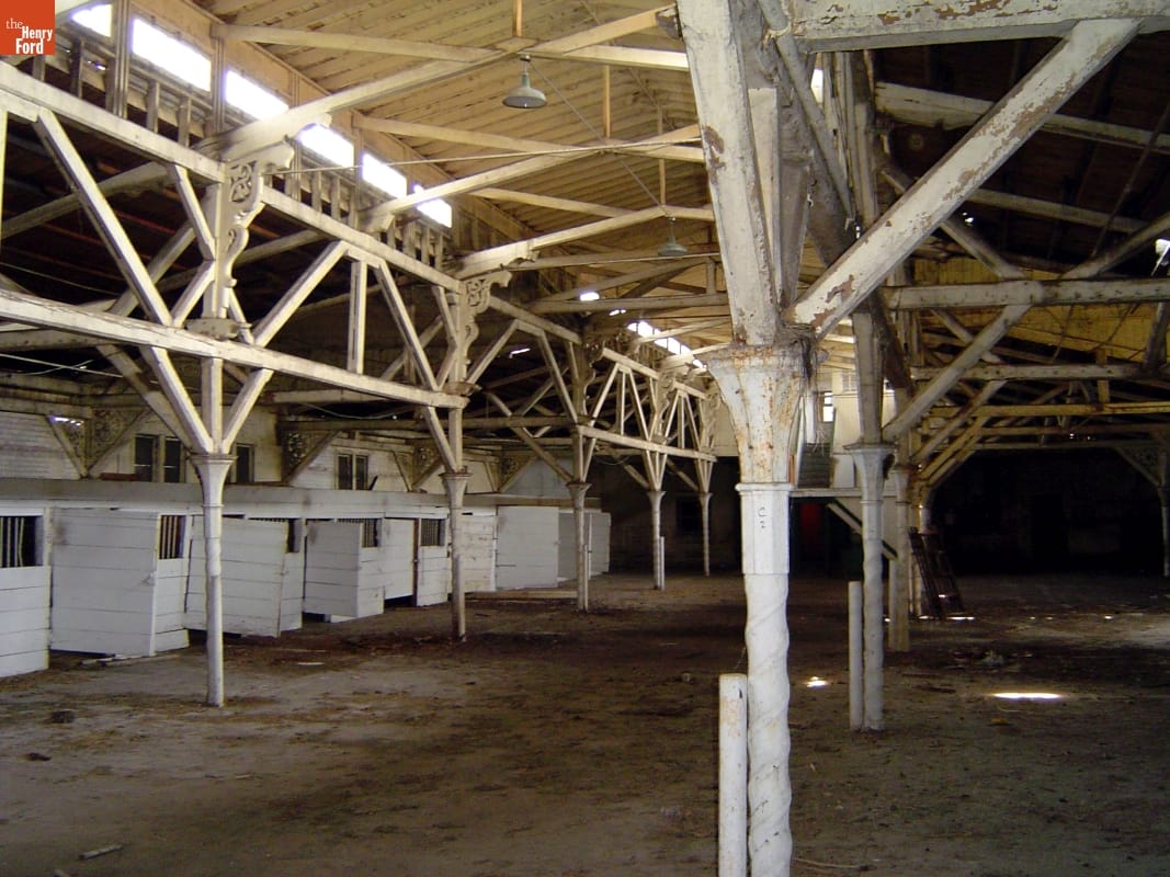 Cast-iron columns on the Detroit Central Farmers Market building made to resemble stone below the capital and wood above the capital.