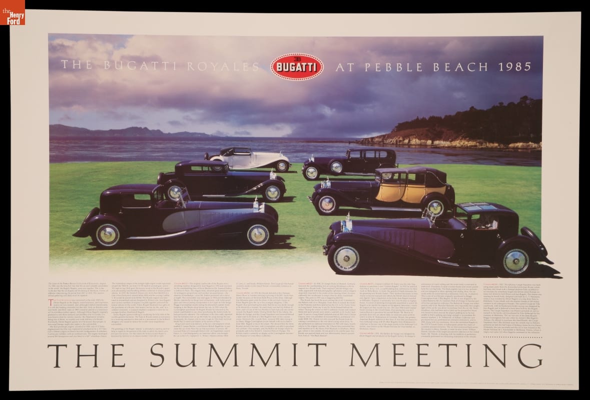 Six long cars on a green lawn in front of a body of water