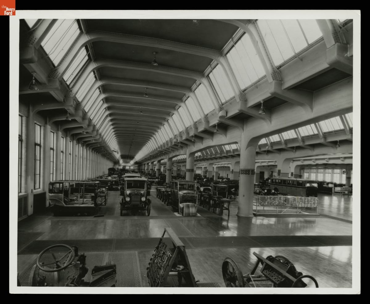 Objects Collected for the Future Henry Ford Museum, Stored at the Ford Engineering Laboratory, Dearborn, Michigan, 1926 Cars and other objects stored in a vast, tall room with many windows