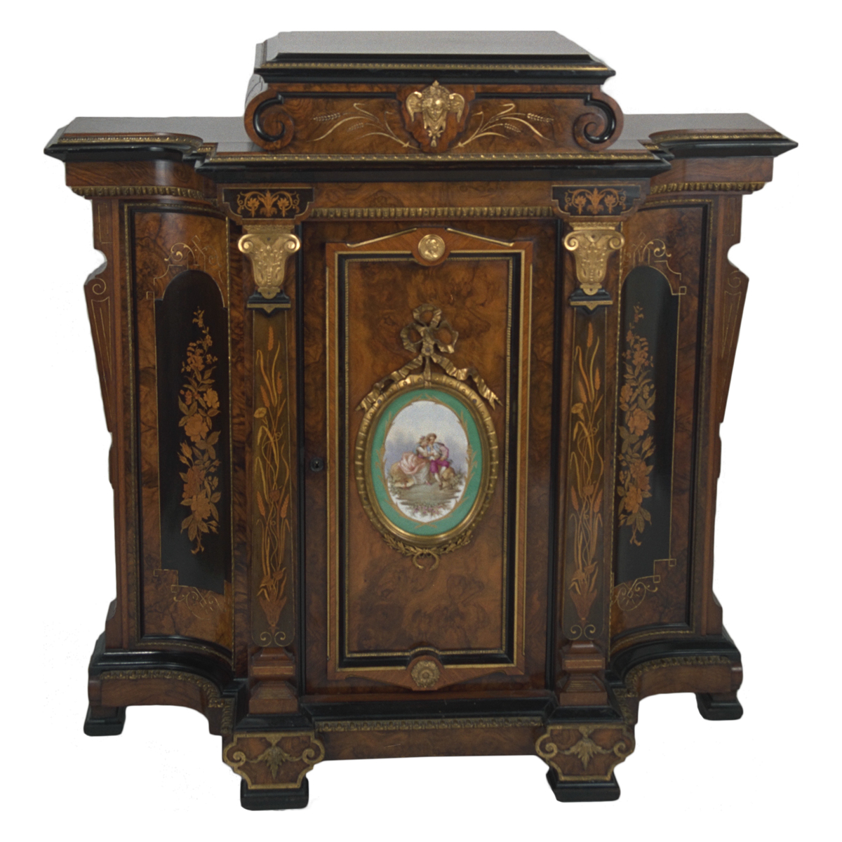 Elaborate wooden cabinet with inlay, gilt, and an oval painting on the front
