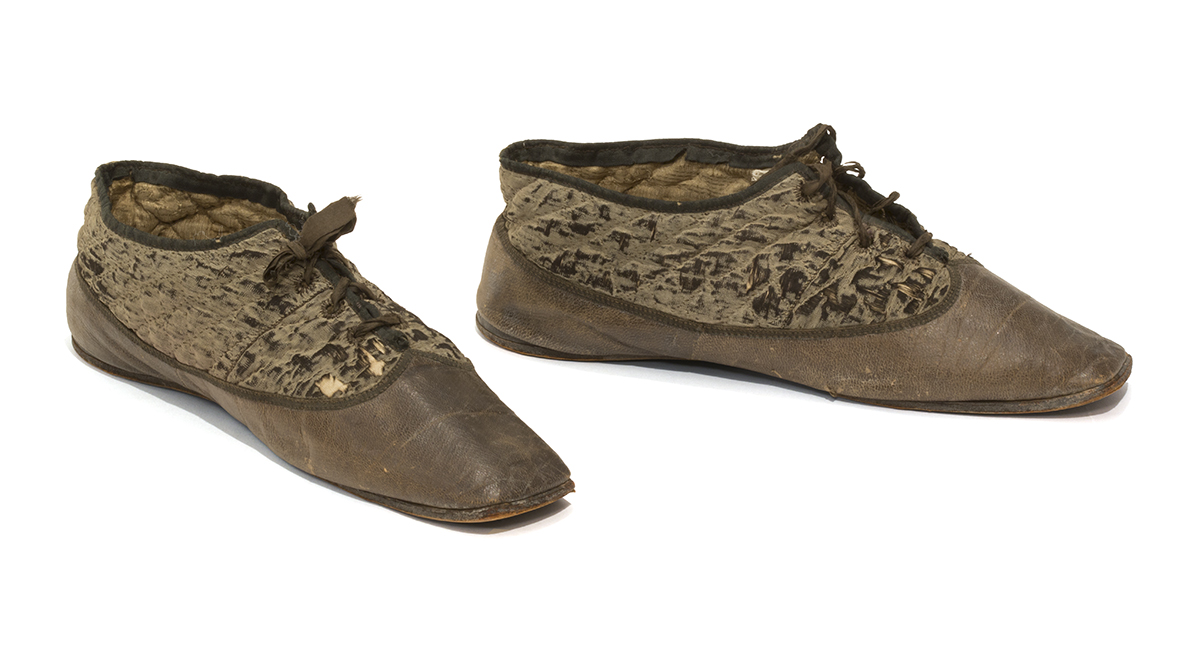 Women's House Slippers, 1840-1855 Brown shoes with leather at bottom and quilted fabric above, tied with laces