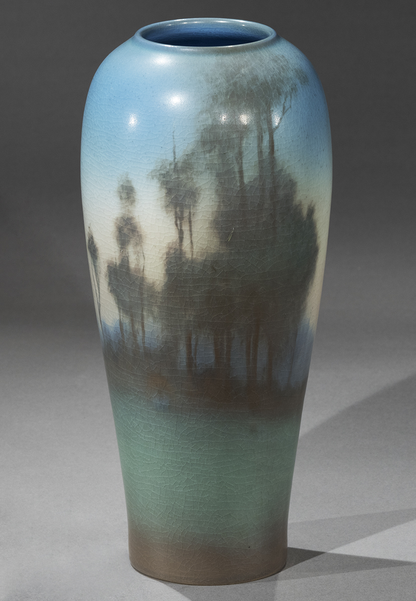 Vase with narrow bottom widening slightly to top with impressionistic painting of trees