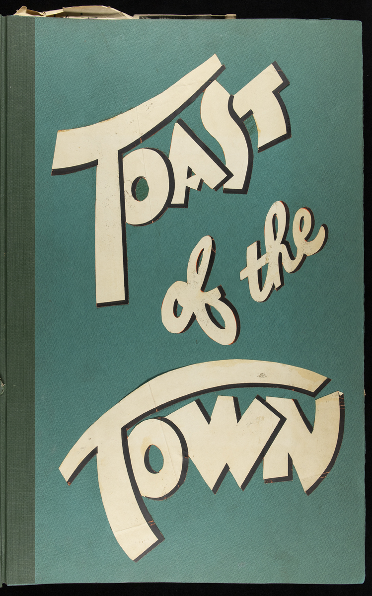 Teal-colored cover with curved text "Toast of the Town"
