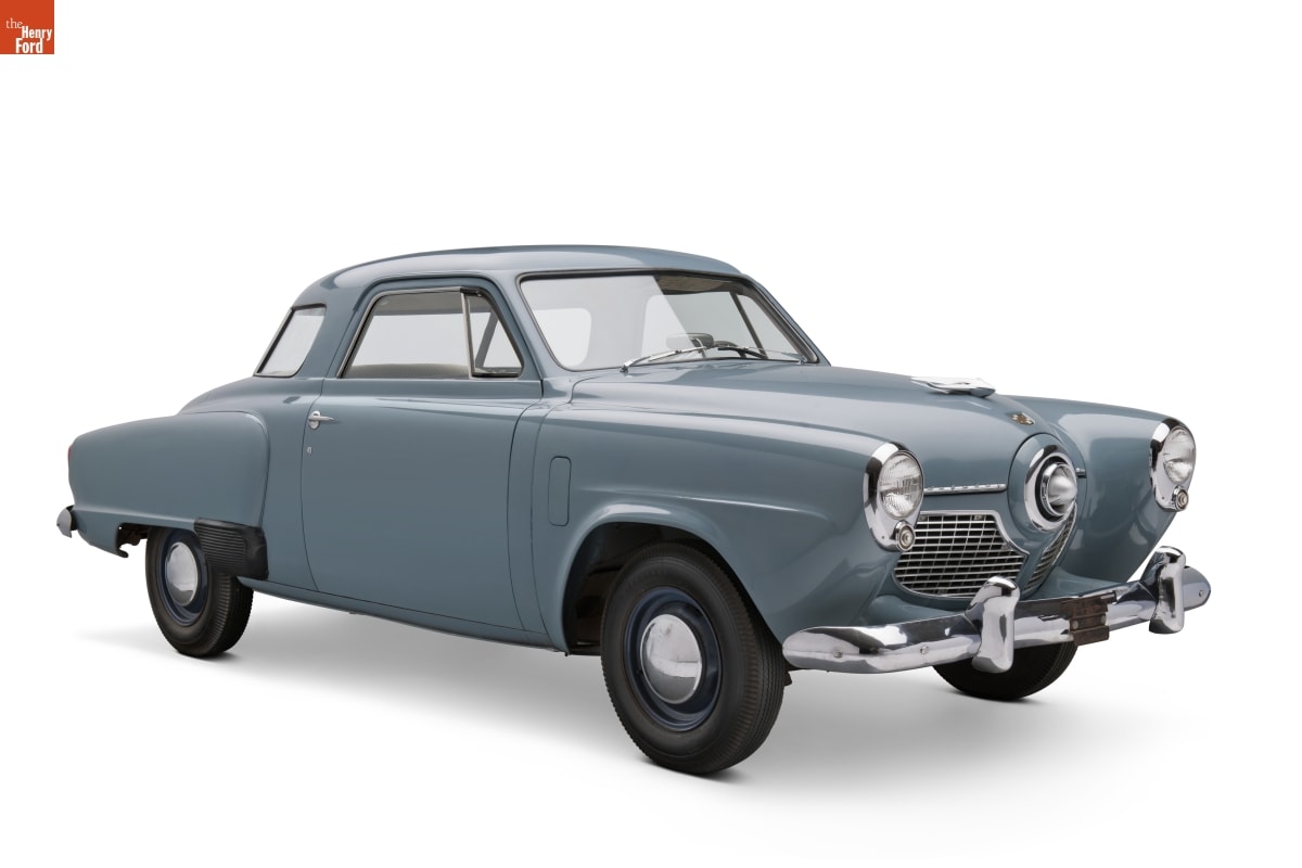 Light blue car with distinctively pointed headlights and center front grille