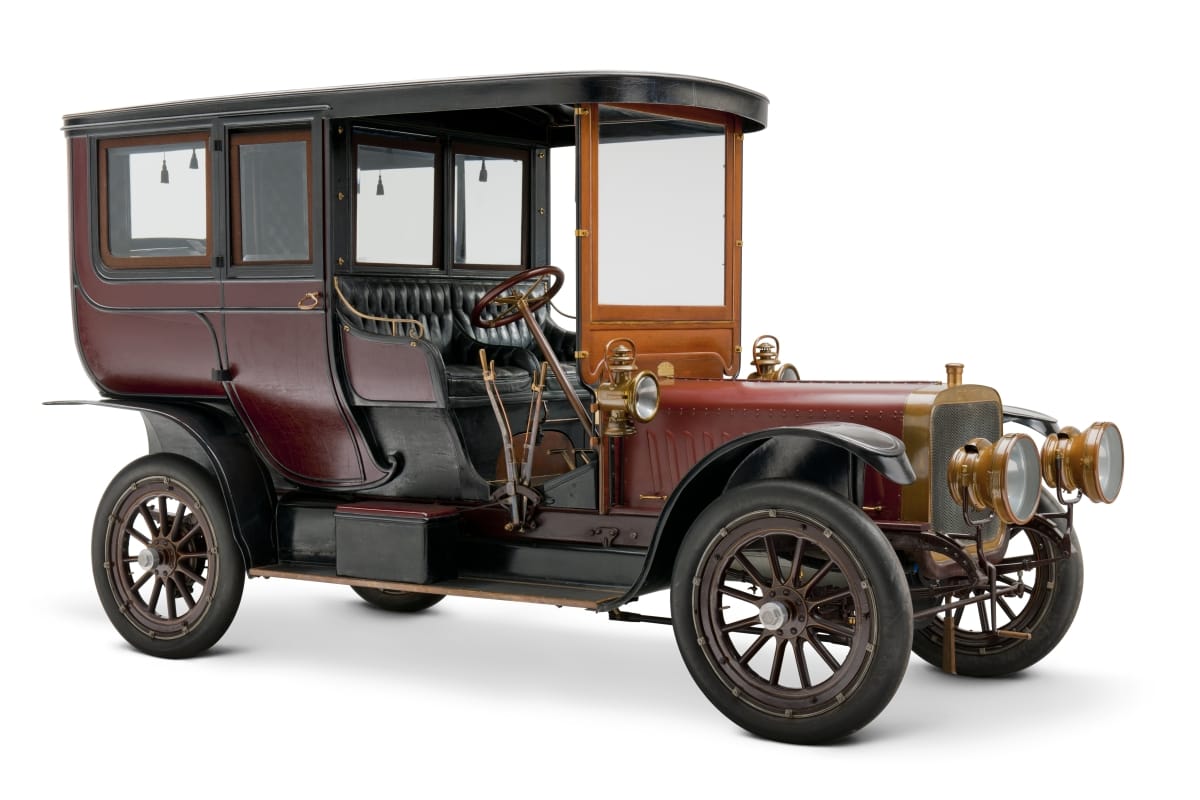 Long, tall boxy maroon automobile